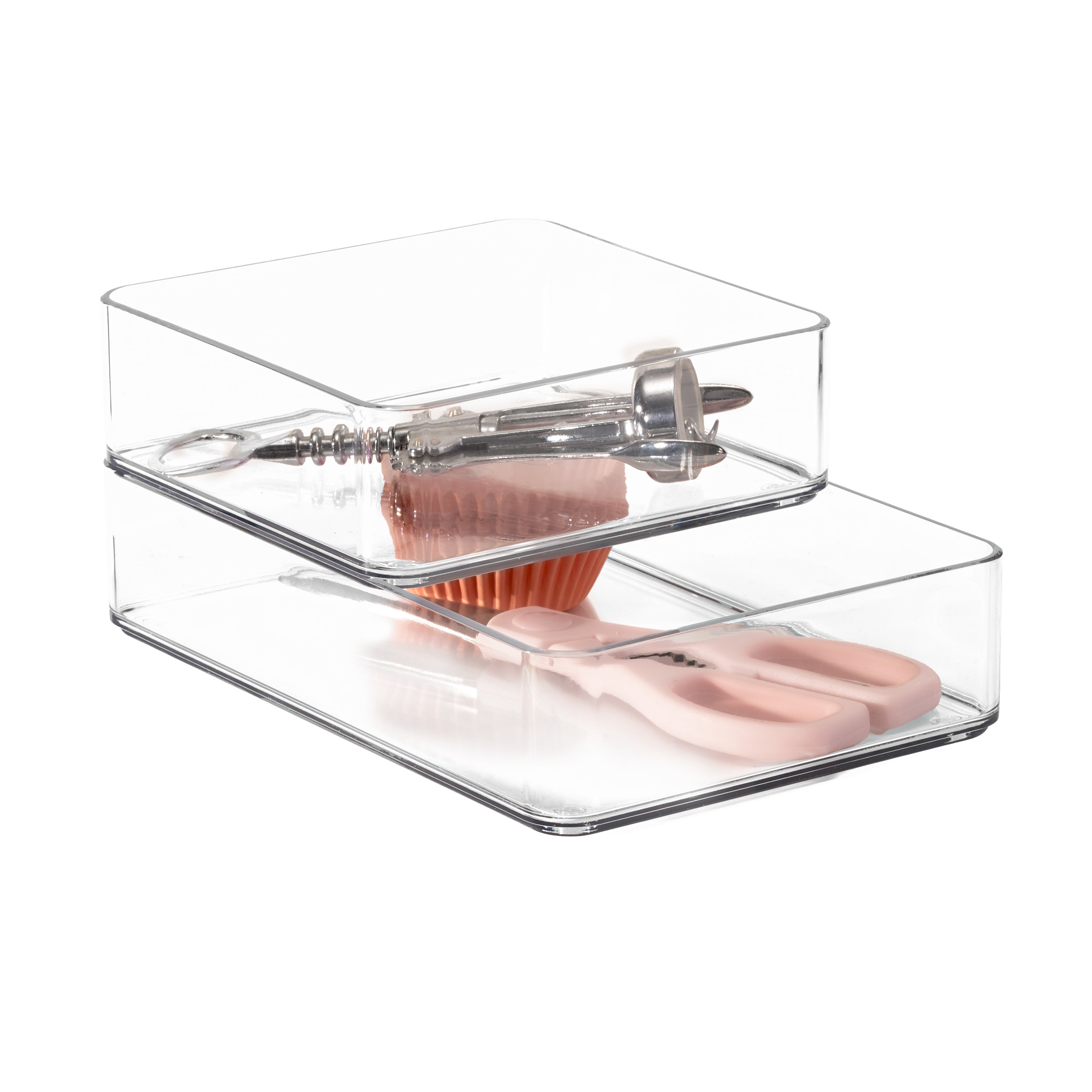 Clear plastic organiser with kitchen utensils on a white background