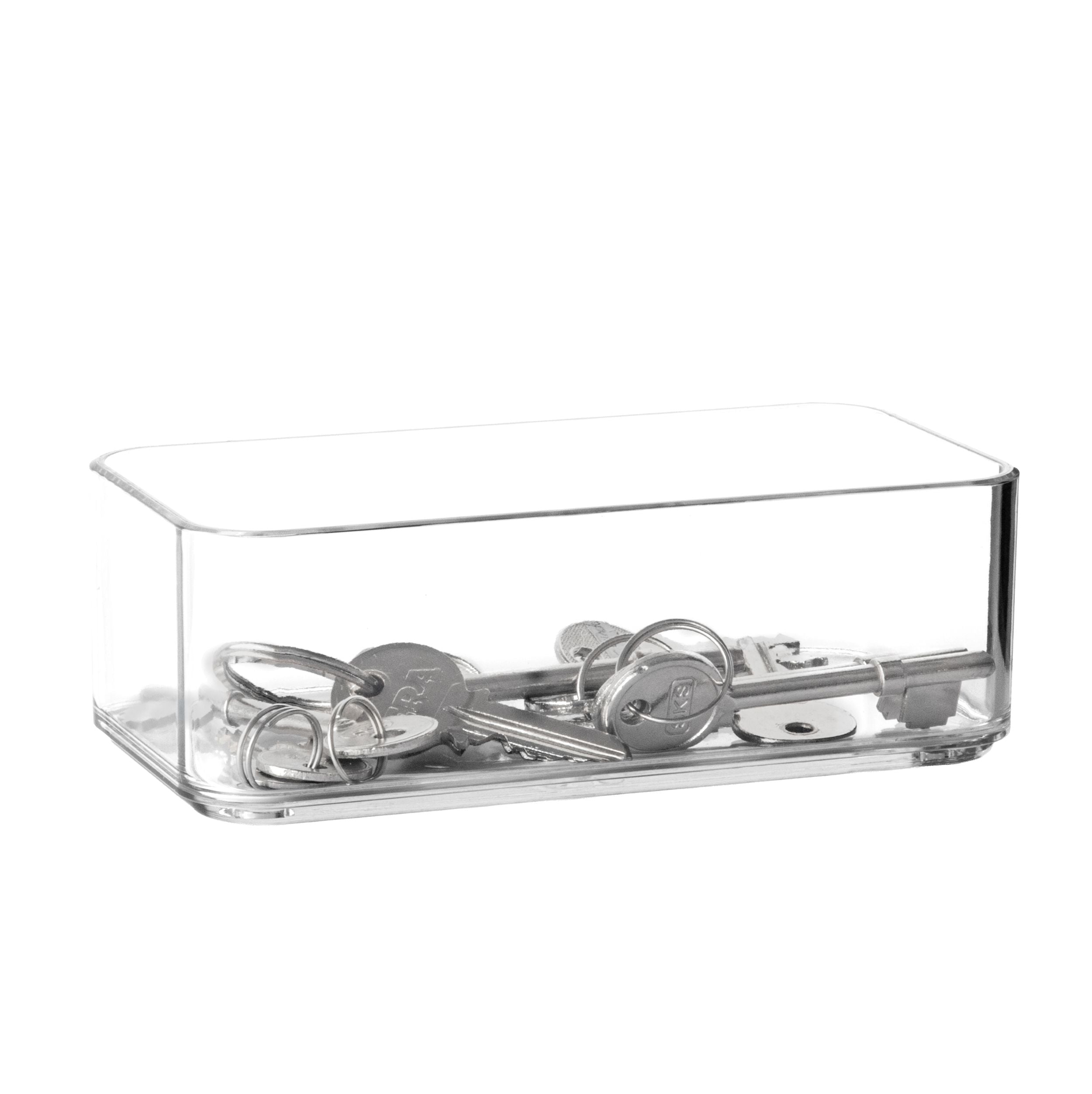 Clear acrylic organiser with keys on a white background