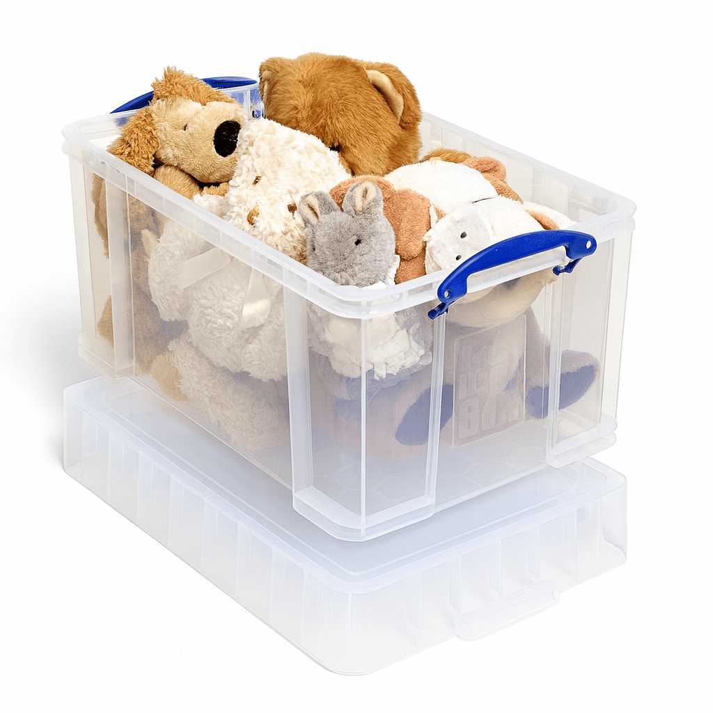 Really Useful Box 48 Litre XL Clear storage box with blue handles filled with stuffed animals on a white background