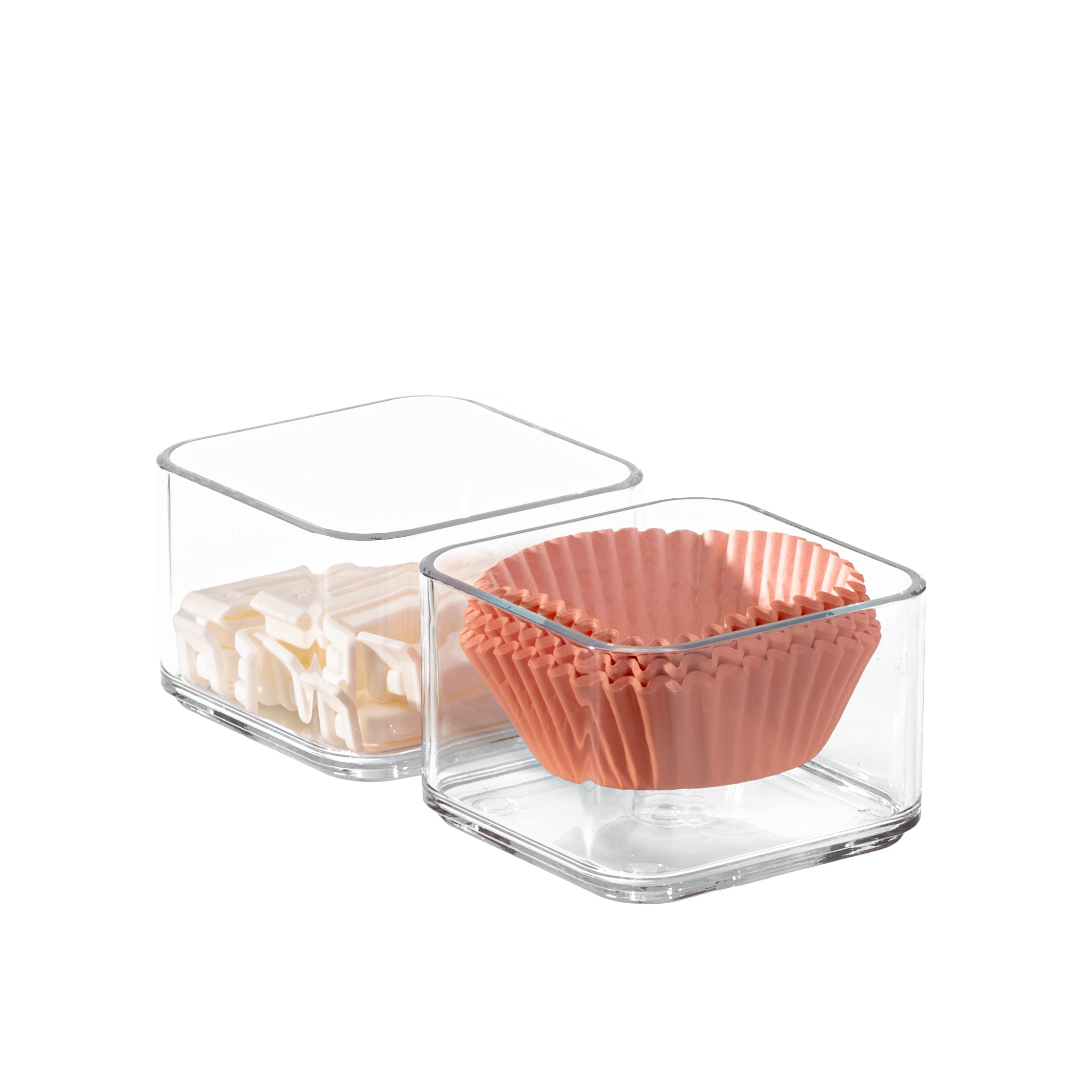 Clear plastic organizer with kitchen items on a white background