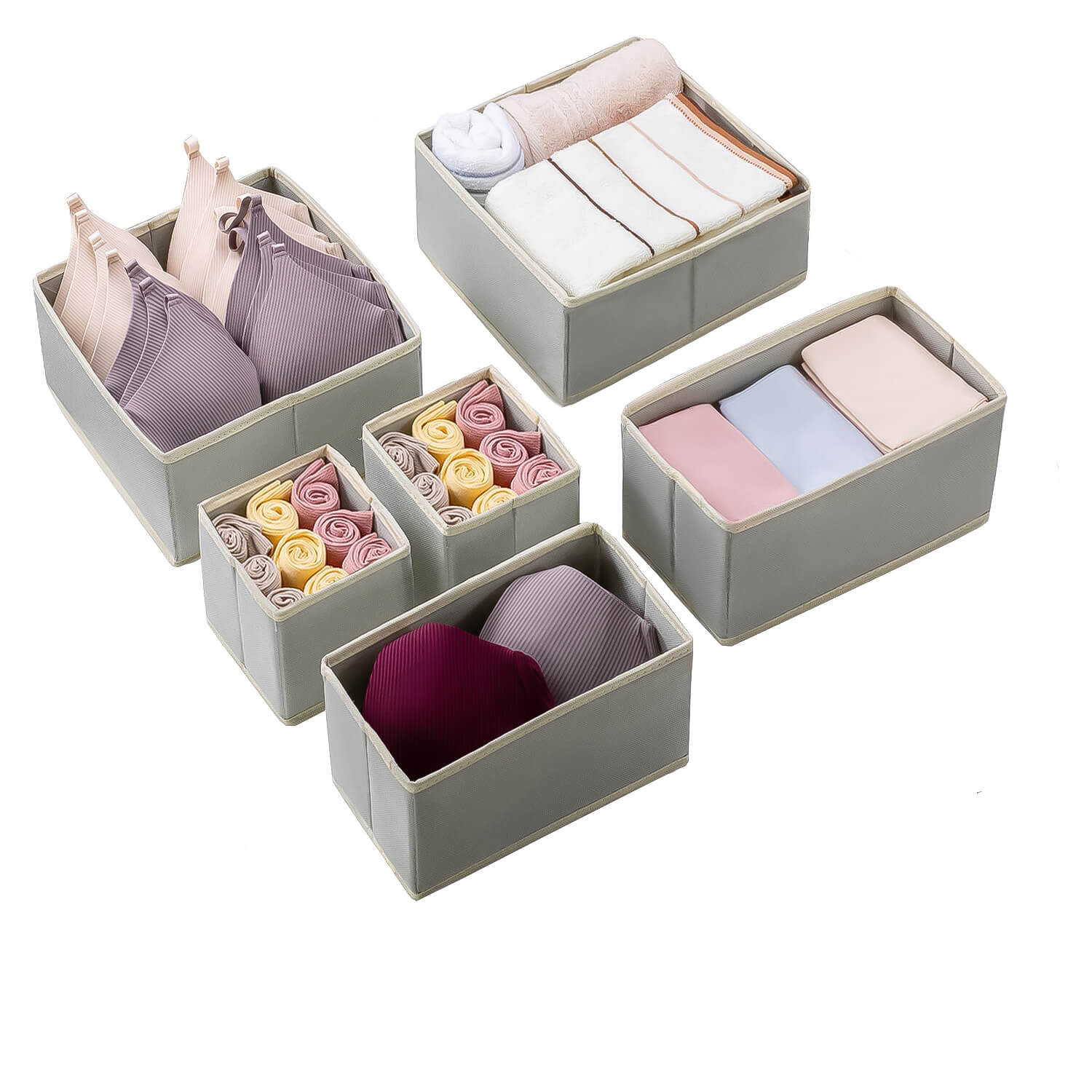 Set of gray storage boxes containing various folded garments on a white background