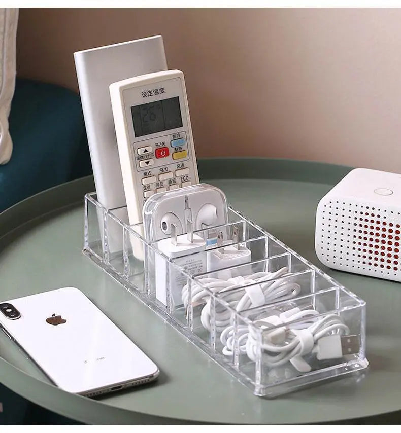 Clear organizer with electronic devices on a table