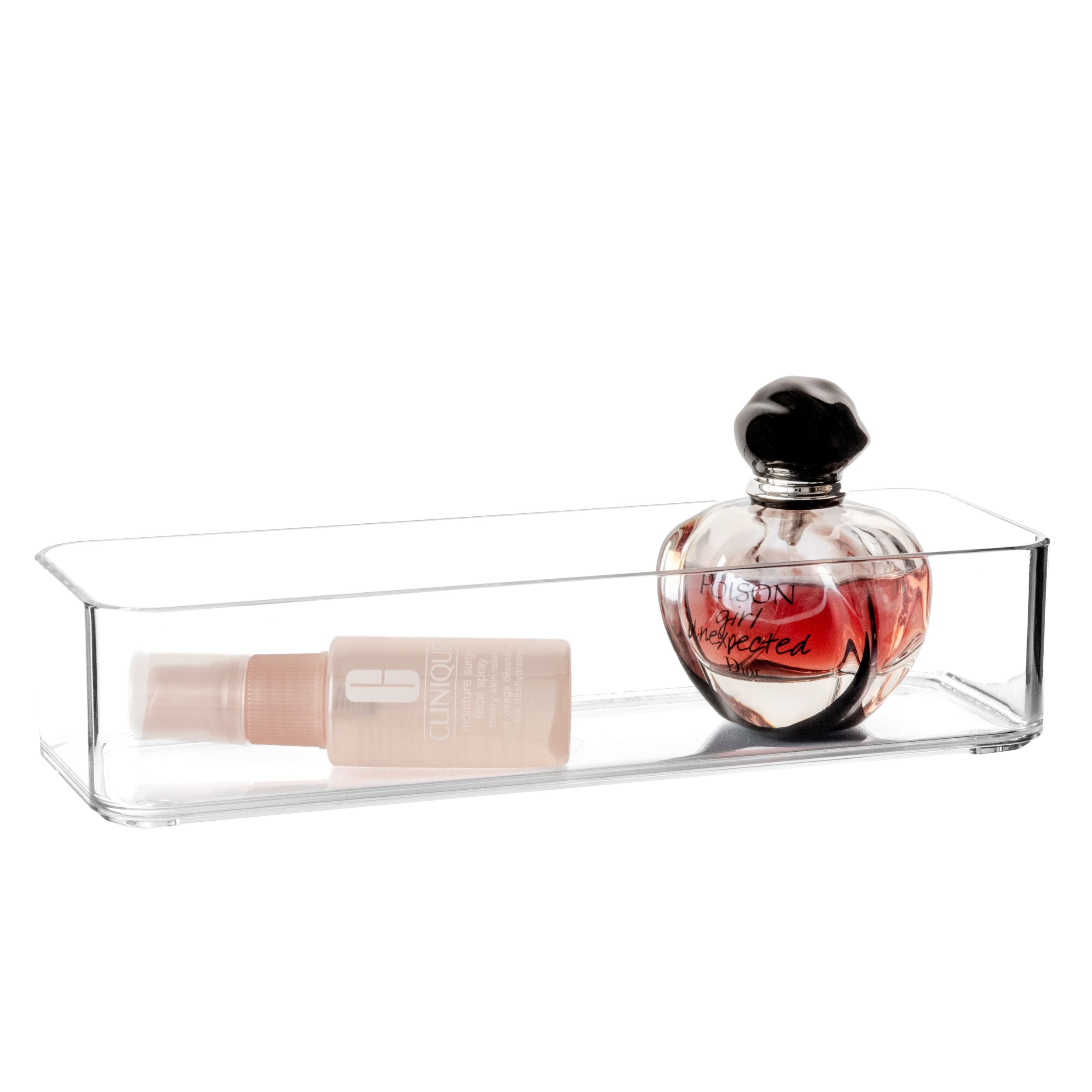 Clear plastic organiser with a perfume bottle and a small container on a white background