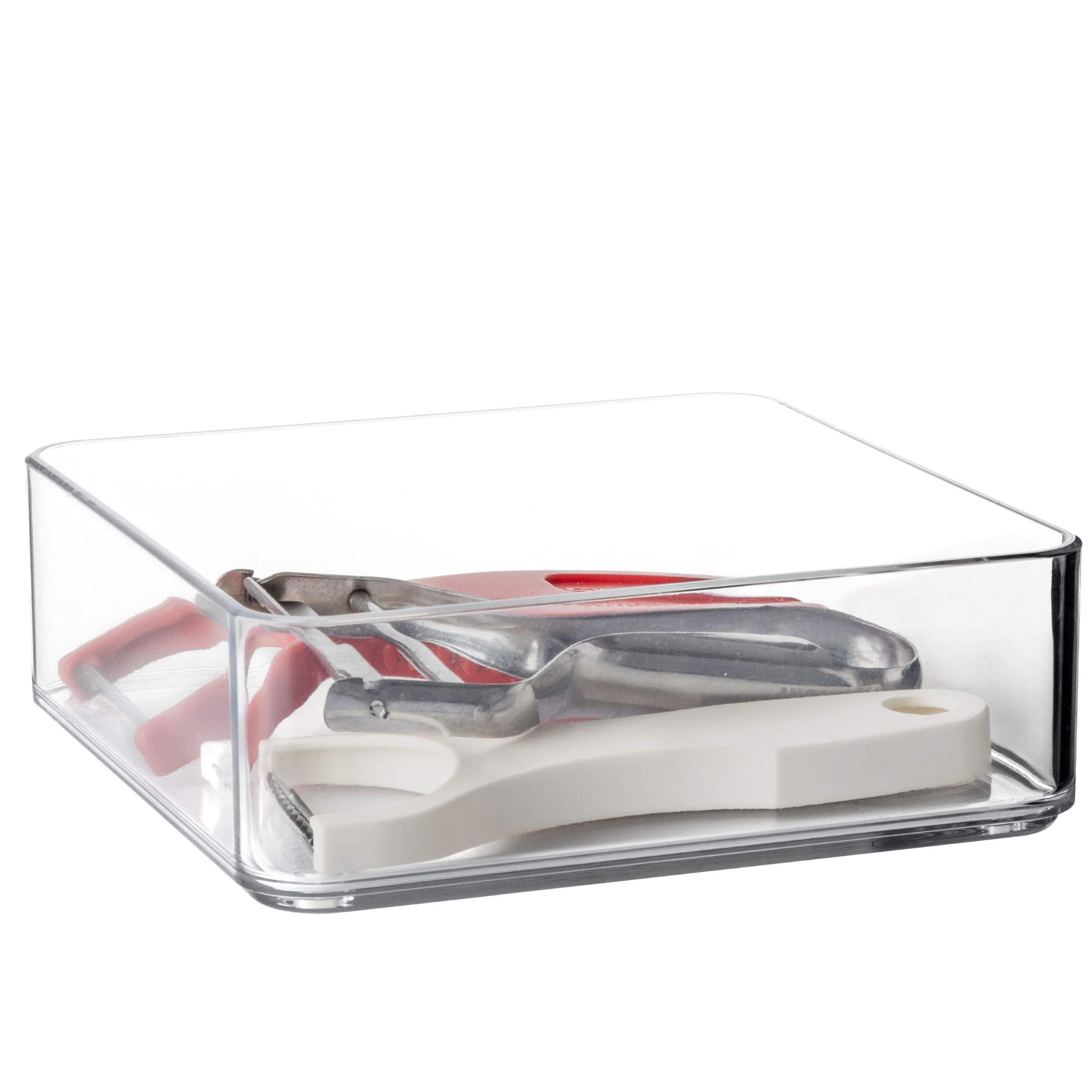 Clear plastic drawer organiser with kitchen utensils on a white background 