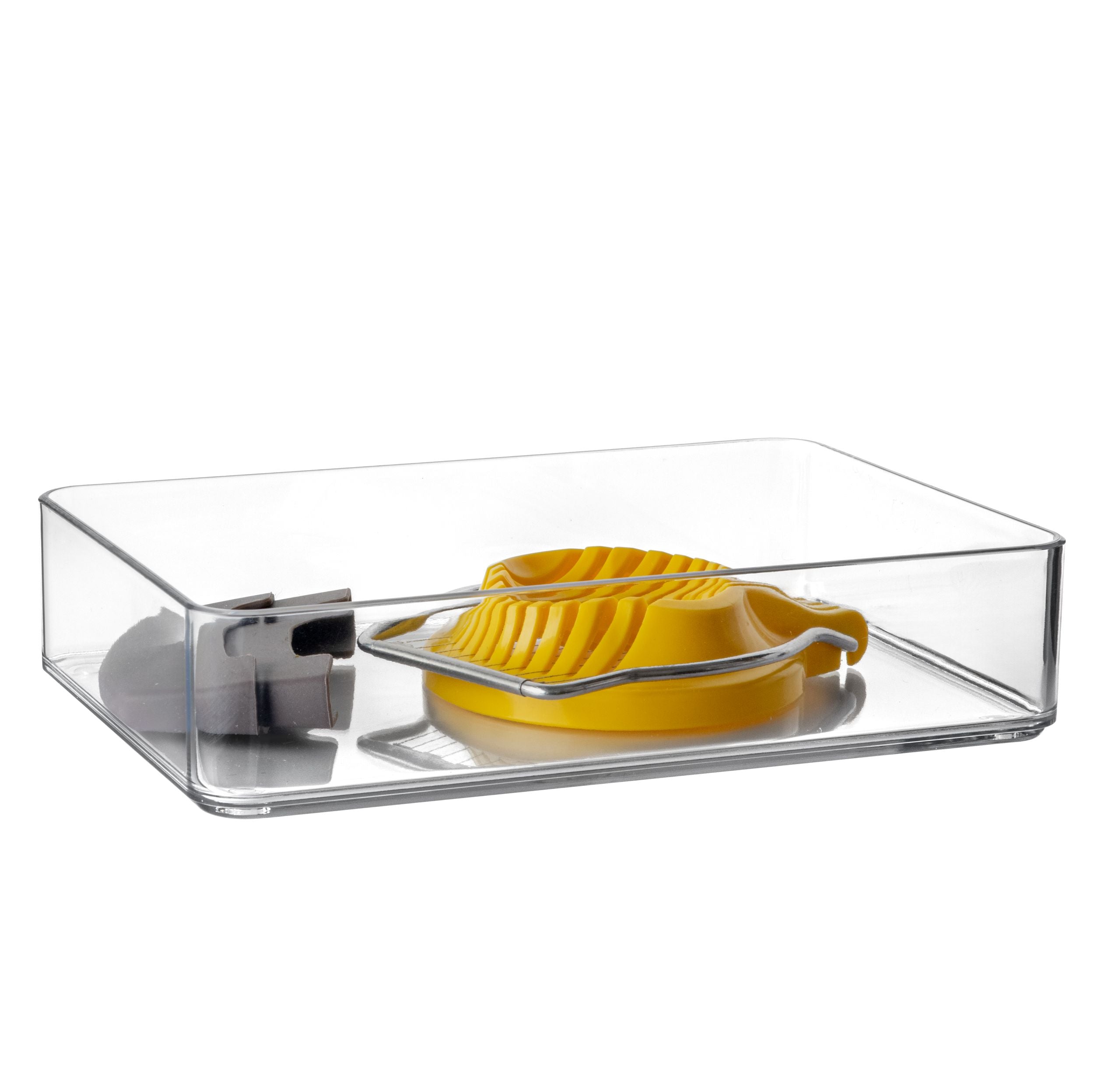 Clear plastic organisers with a yellow egg cutter on a white background