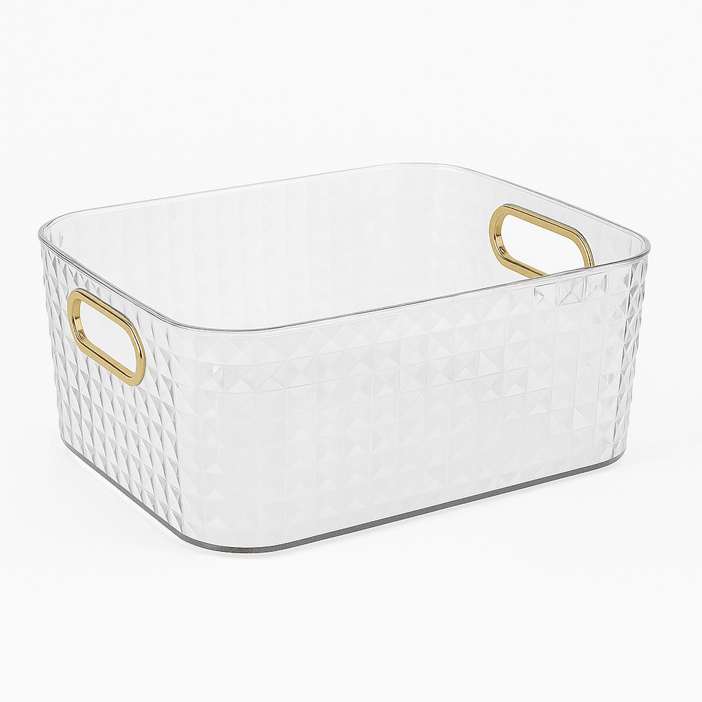 Clear storage basket with gold handles on a white background
