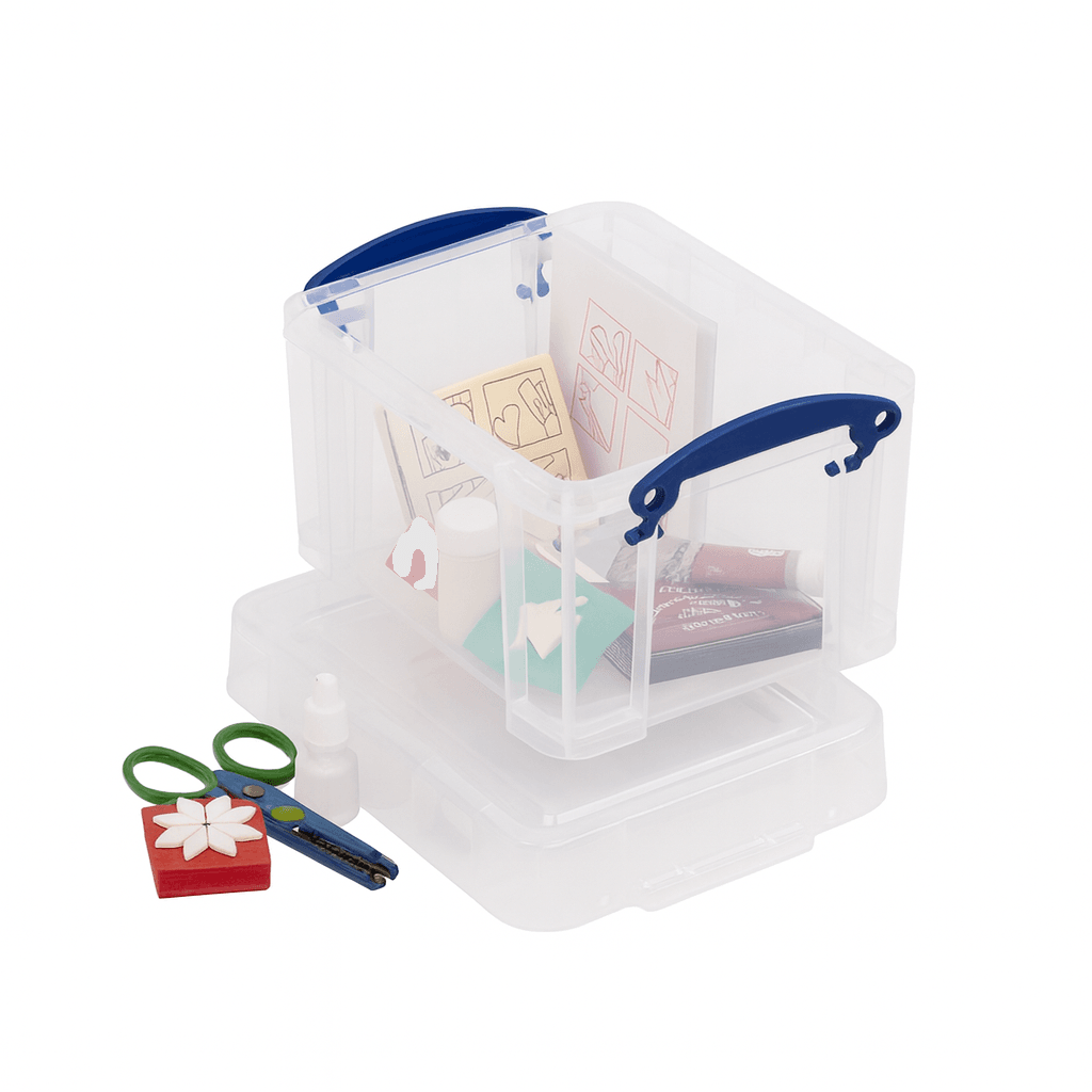 Clear plastic storage box with blue handles containing stationery items on a white background