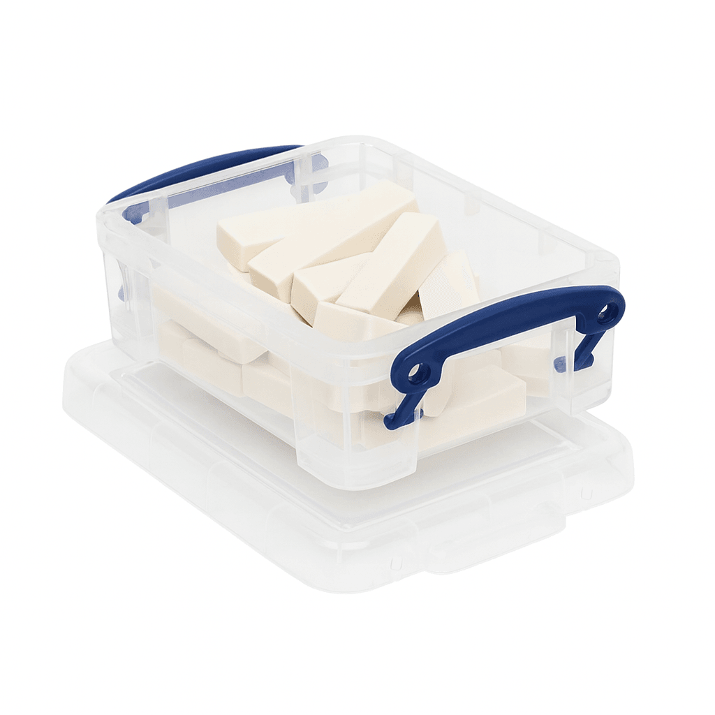 Clear storage container with blue lid holding white blocks on a white background