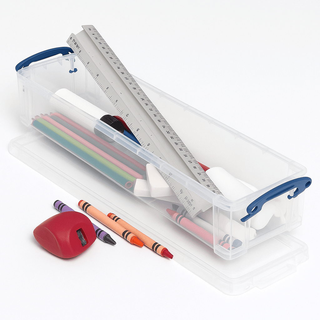 Really useful Box Clear pencil case with stationery items including a ruler, pens, crayons, and a sharpener on a white background.