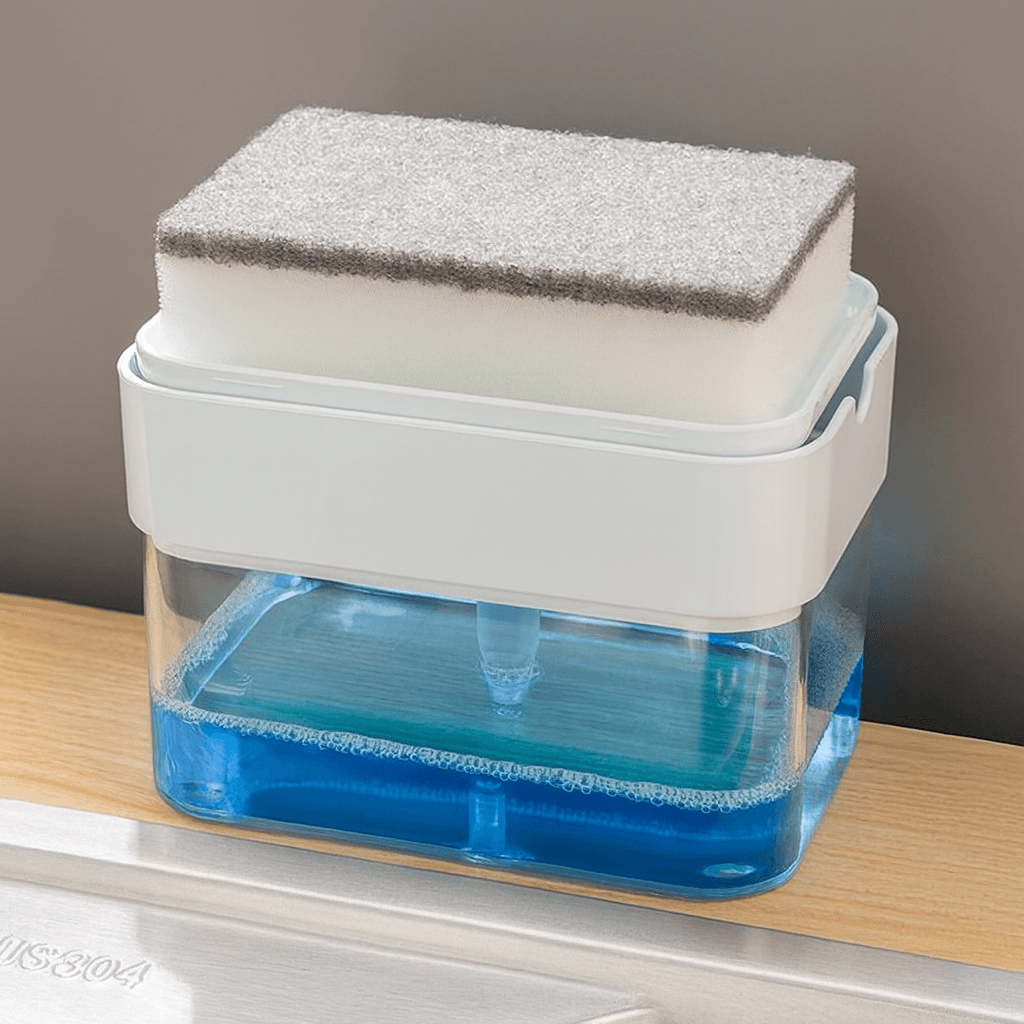 Cleaning sponge on the soap dispenser containing blue Soap on a wooden surface.