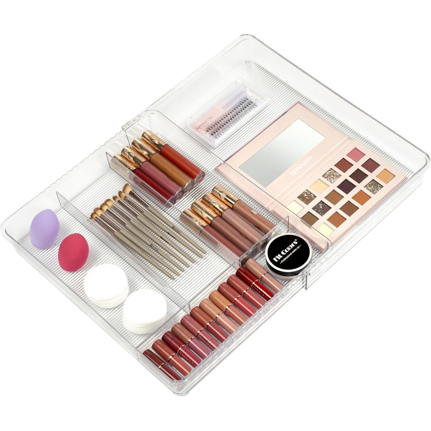 Makeup set with lipsticks, lip glosses, and eyeshadows in a clear expandable organizer on a white background
